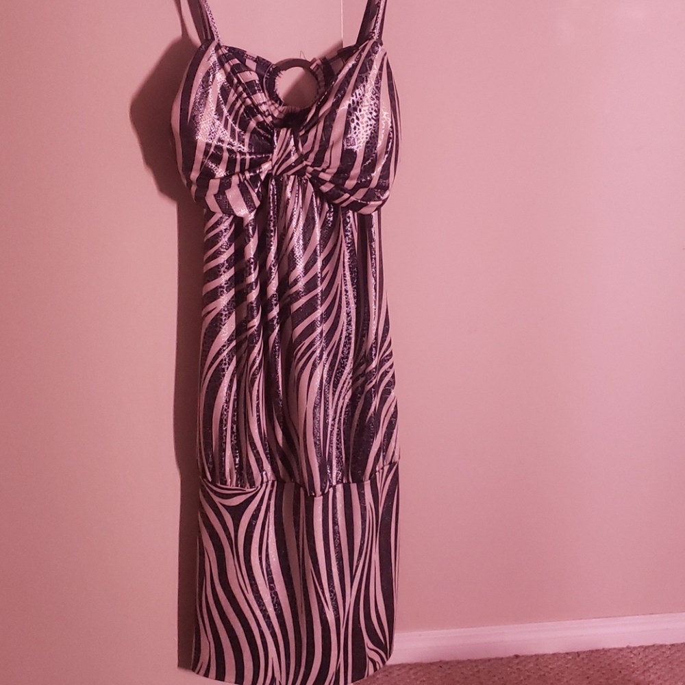 Zebra designed cocktail dress with open back.